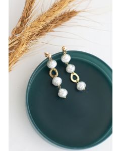 Aretes colgantes circulares de perlas y oro